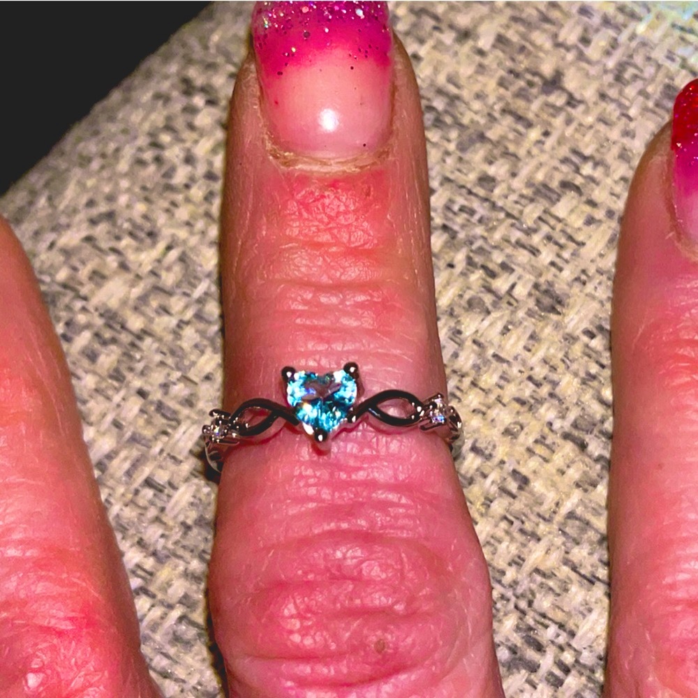 Ring, Silver (colored, not 925) w/light blue heart stone. Size 7, 8 or 9.